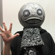 Yoko Taro appears in his trademark Emil mask at the Game Developers Conference in San Francisco
